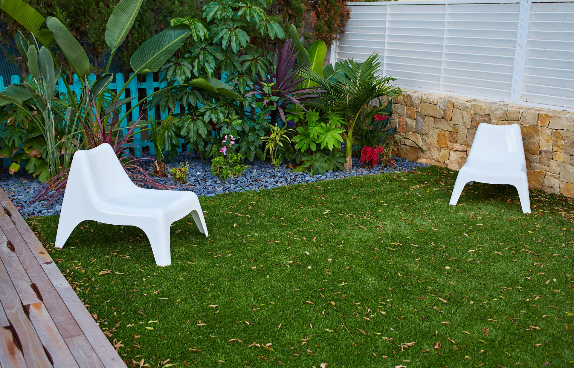 A landscaped Australian backyard with freshly laid artificial turf